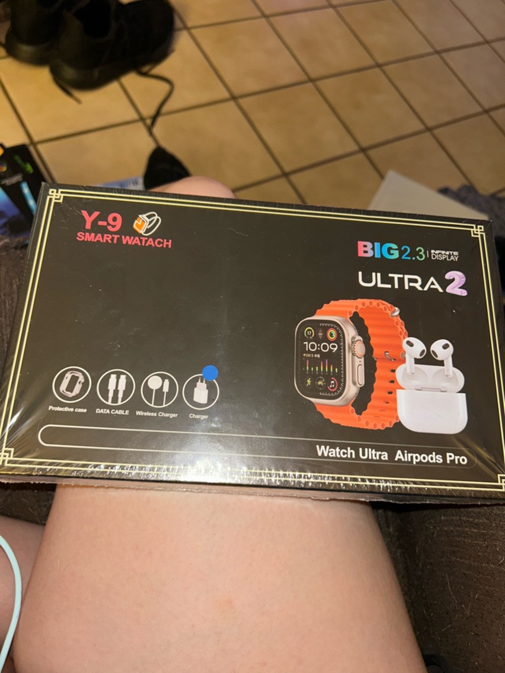 Ultra 2 Smart Watch with Orange Strap and Wireless Earbuds